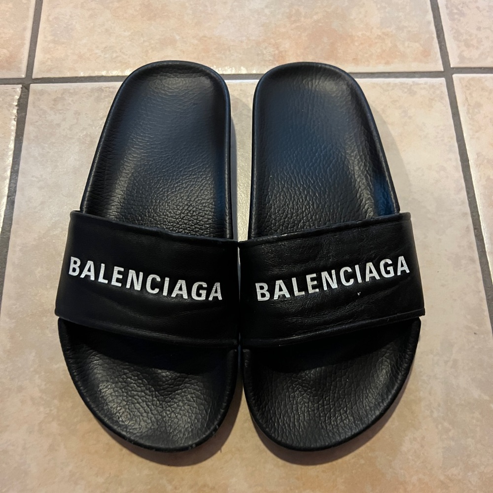 Balenciaga pool slides.